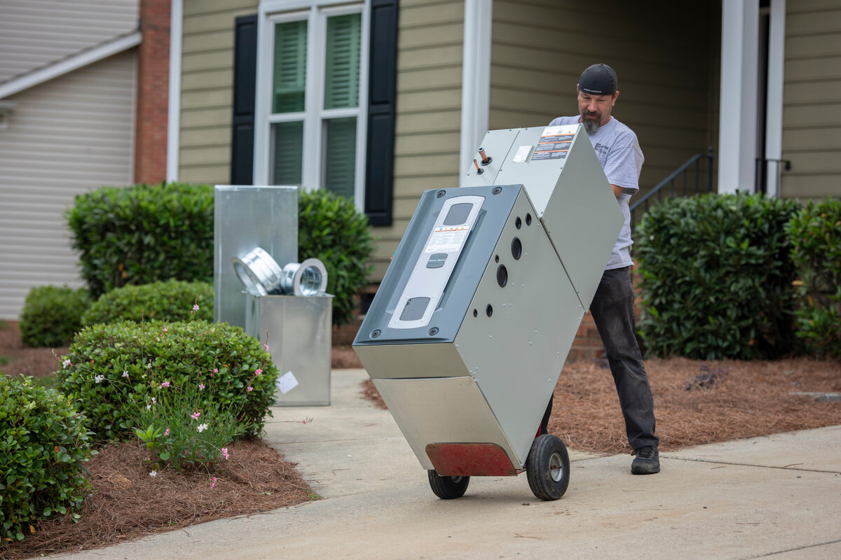 employee wheeling equipment outside