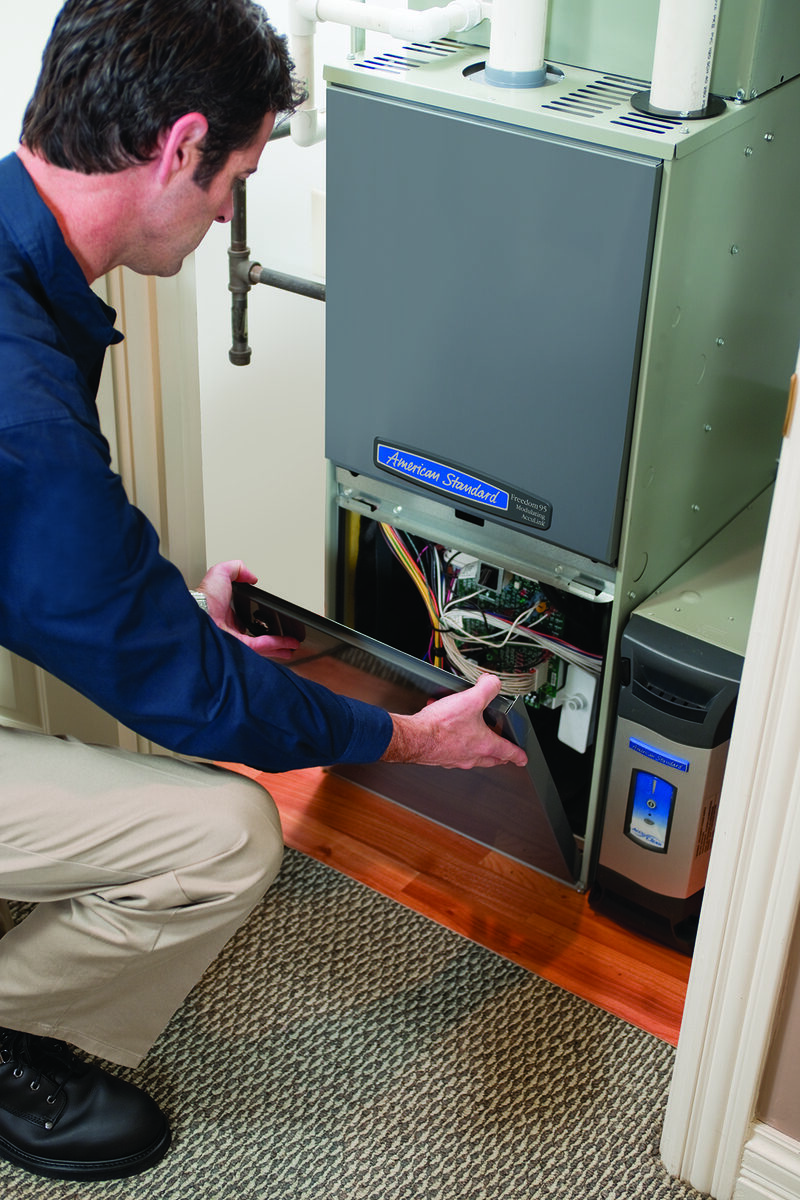 HVAC technician servicing equipment